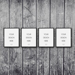 Peut inclure: Quatre cadres photo noirs avec des passe-partout blancs sont accrochés à un mur en bois gris. Chaque cadre contient le texte "YOUR DESIGN HERE".