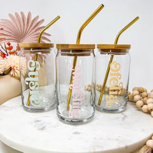 Violet glass cup with lid and straw on a white background isolated. Mason  jar with handle and screwed down cap. Empty mug no spill. Stock Photo