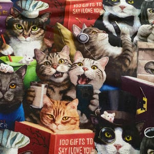 May include: A colorful illustration of a group of cats reading books, wearing hats, and listening to music. The illustration features the text "100 Gifts to Say I Love You" on two of the books.