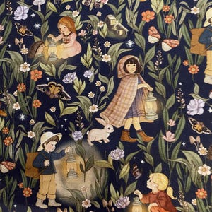 May include: Navy fabric featuring a whimsical illustration of children with lanterns, butterflies, flowers, and a rabbit. The design has a vintage, storybook aesthetic, set in a forest scene.