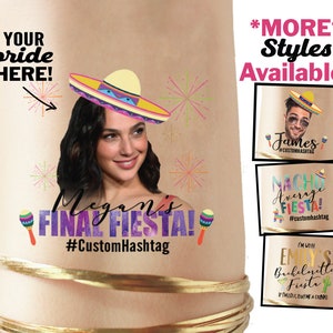 May include: A temporary tattoo design featuring a woman wearing a sombrero and the text "Megan's Final Fiesta! #CustomHashtag".  The tattoo also includes maracas and fireworks.  The image shows other tattoo designs with the text "James #CustomHashtag", "Nacho Average Fiesta! #customhashtag", and "I'm with Emily's Bachelorette Fiesta! If I'm lost, buy me a drink!"