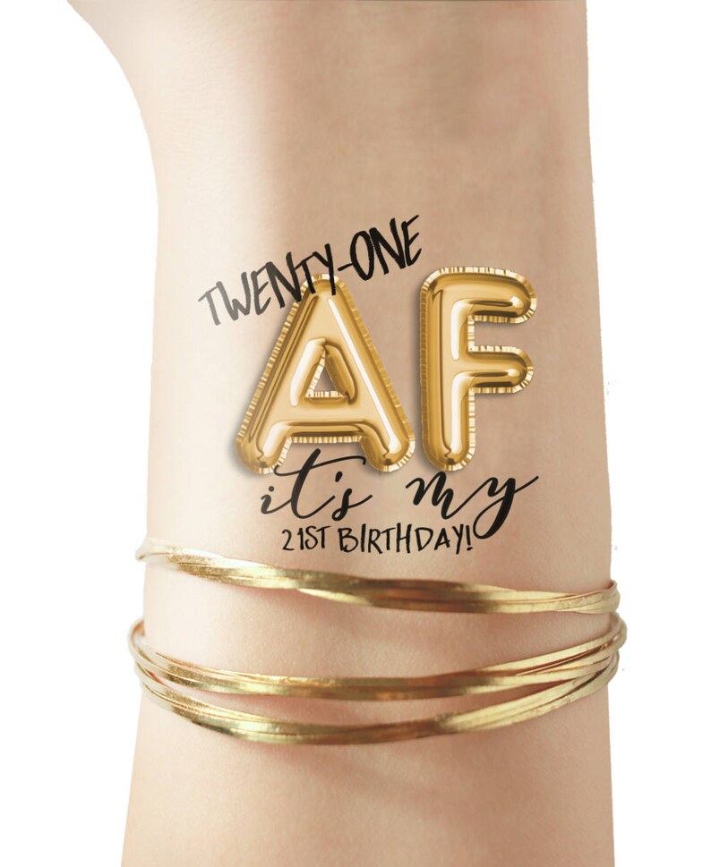 May include: Gold balloon letters spelling "AF" with the text "Twenty-one" above and "it's my 21st birthday!" below.