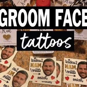 May include: A set of temporary tattoos featuring a man's face with the text "Luckiest Man Alive!" and an arrow pointing to the right. The tattoos are printed on white paper with a red heart and the name "Jason" written below.