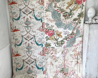 May include: A patchwork fabric panel with a white background and a variety of floral and bird designs in shades of pink, green, blue, and red. The panel is made up of four different pieces of fabric, each with a unique pattern.