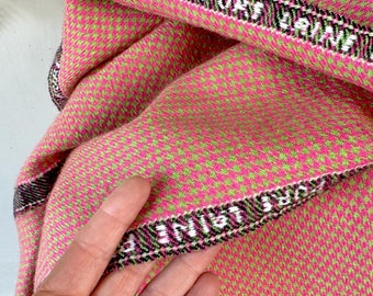 May include: Pink and green woven fabric with a black, white, and green trim. The trim has the text "PURE LINEN" on it.