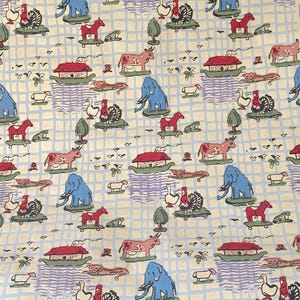 May include: Fabric with a repeating pattern of animals, houses, and trees on a light blue grid background. The animals include elephants, horses, cows, and ducks. The houses have red roofs. The fabric has a vintage, whimsical feel.