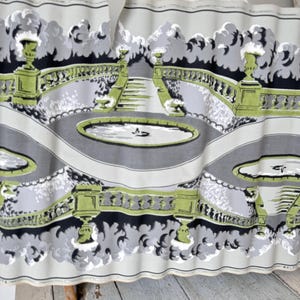 May include: A vintage wallpaper border with a repeating pattern of a garden scene. The border features a gray and white background with green and black accents. The garden scene includes a pond, a fountain, and a staircase.