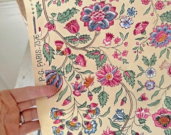 May include: A vintage floral fabric with a cream background and a repeating pattern of pink, blue, and green flowers and leaves. The fabric has the text "P.G. PARIS-7576" printed on the side.