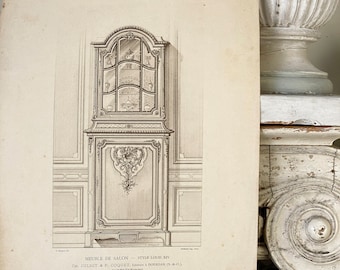 May include: A black and white line drawing of a Louis XIV style cabinet with glass doors and intricate carvings. The cabinet is shown in a room with wainscoting and a decorative cornice. The text "MEUBLE DE SALON - STYLE LOUIS XIV" is printed below the image.