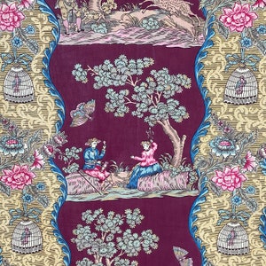 May include: A vintage fabric design with a burgundy background featuring a repeating pattern of stylized trees, birds, butterflies, and people. The design is framed by a gold and blue border with a repeating pattern of stylized cages.