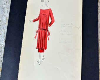 May include: A hand-drawn illustration of a red dress with a pleated skirt and a sash. The dress is designed with a scoop neckline and long sleeves. The illustration is labeled "9183" and "mouchoir de laine rouge" in French.