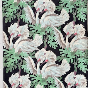 May include: A fabric with a repeating pattern of white birds with red beaks and crests, set against a backdrop of green foliage and a black background. The birds have detailed feathering and are in various poses.