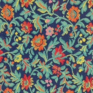 May include: A close-up of a fabric with a repeating pattern of blue, green, yellow, red, and pink flowers. The fabric has a textured woven look.