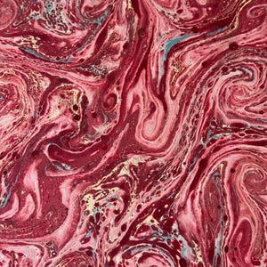 May include: Abstract artwork with a swirling pattern in shades of red, pink, and gold. The design features a marbled effect with fluid lines and organic shapes, creating a dynamic and textured visual.