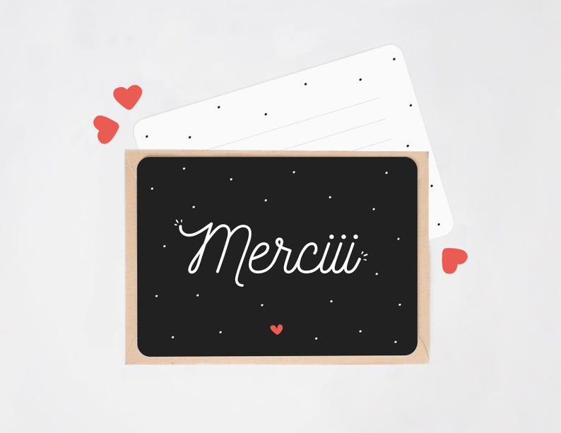 May include: A thank you card with a black background and white lettering. The card says 'Merciii' in a script font.  The card is accented with small red hearts.  It's accompanied by a white envelope with small black dots. The card is a simple, elegant design, perfect for expressing gratitude.