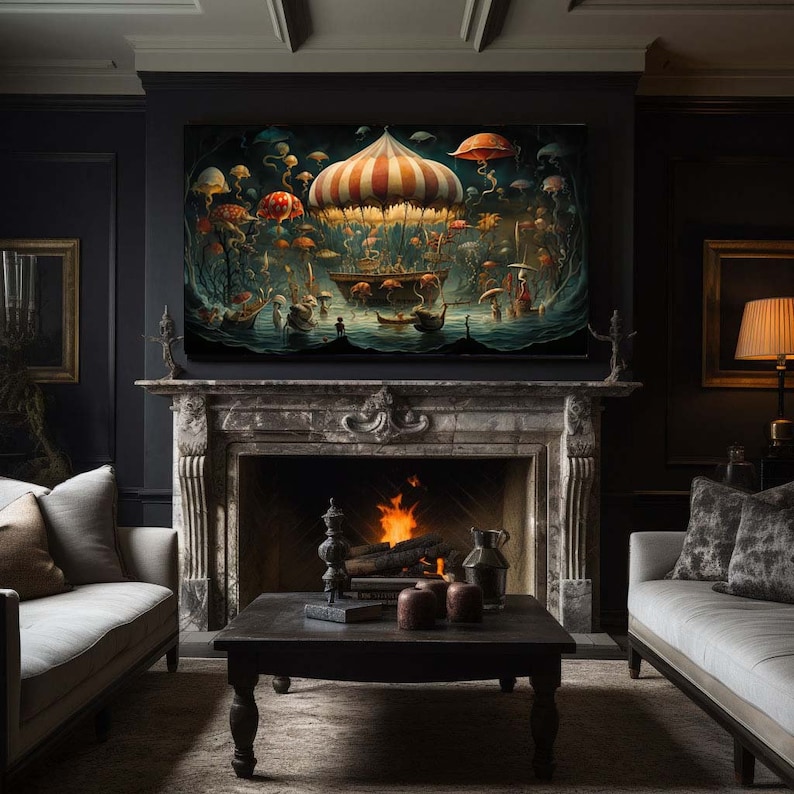May include: A dark living room with a fireplace and a large painting above it. The painting is a surreal scene with a large red and white striped tent over a ship. The tent is surrounded by jellyfish and other sea creatures. The fireplace is lit and there are two couches on either side of it. The couches are both gray and have pillows on them. There is a coffee table in front of the fireplace with a book and two decorative objects on it.