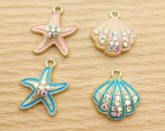 May include: Four gold-tone charms with iridescent rhinestones. Two charms are pink seashells and two charms are blue starfish.