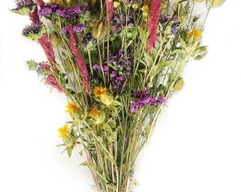 May include: A bouquet of dried wildflowers in shades of purple, pink, yellow, and green. The flowers are tied together with twine.