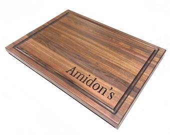 Large Black Walnut Cutting Board with Juice Groove and Built in Handles and engraving included.