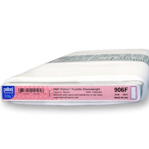 May include: A white roll of 906F Pellon Fusible Sheerweight fabric, 100% polyester, 20 inches long. The label reads "906F Pellon Fusible Sheerweight Apparel-Basics 100% Polyester Machine wash warm and tumble dry or dry clean www.PellonProjects.com 906F 20 IN 2012 MADE IN USA"
