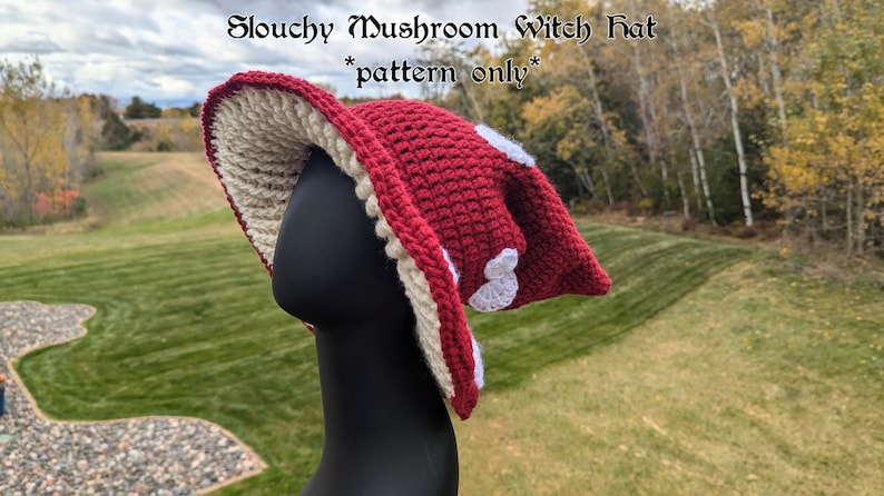 May include: A slouchy red and white crocheted mushroom witch hat with white polka dots. The hat is on a black mannequin head. The text "Slouchy Mushroom Witch Hat *pattern only*" is at the top of the image.