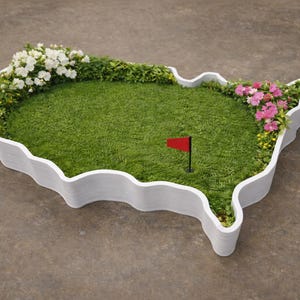 May include: A miniature golf green shaped like the United States, with a vibrant green surface and a red flag. The perimeter is lined with white edging and adorned with colorful flowers, creating a decorative and playful design.