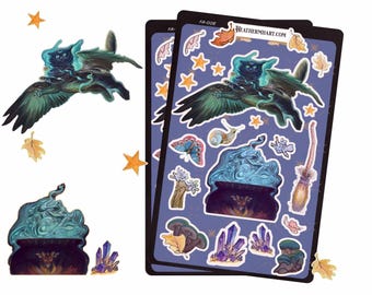 May include: A sticker sheet featuring a black cat with glowing wings, a bubbling cauldron, crystals, and other whimsical illustrations. The stickers have a dark blue background with gold stars and autumn leaves.