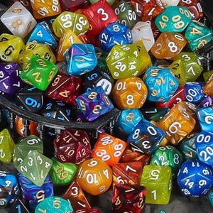May include: A selection of multi-sided dice in a range of colours, including red, blue, green, and yellow. The dice are in various shapes, such as D4, D6, D8, D10, D12, and D20. Perfect for role-playing games and tabletop gaming.