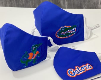 Bestickte Florida Gators Gesichtsmaske. 100% Baumwolle. 3 Lagen. Nasensteg aus Metall. Verstellbare elastische Ohrbänder Option. Hergestellt in den USA.