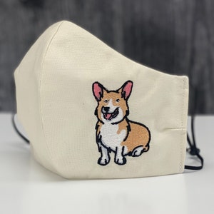 Embroidered Corgi Face Mask.  Pembroke Welsh Corgi. 100% Cotton. 3 Layers. Metal Nose Bridge. Adjustable Elastic.. Made in the U.S.A.