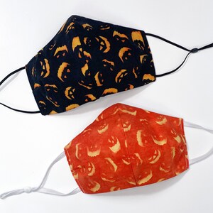 Laughing Pumpkins Halloween Face Mask. 100% Cotton. 3 Layers. Metal Nose Bridge. Adjustable Elastic Ear Straps option. Made in the U.S.A.