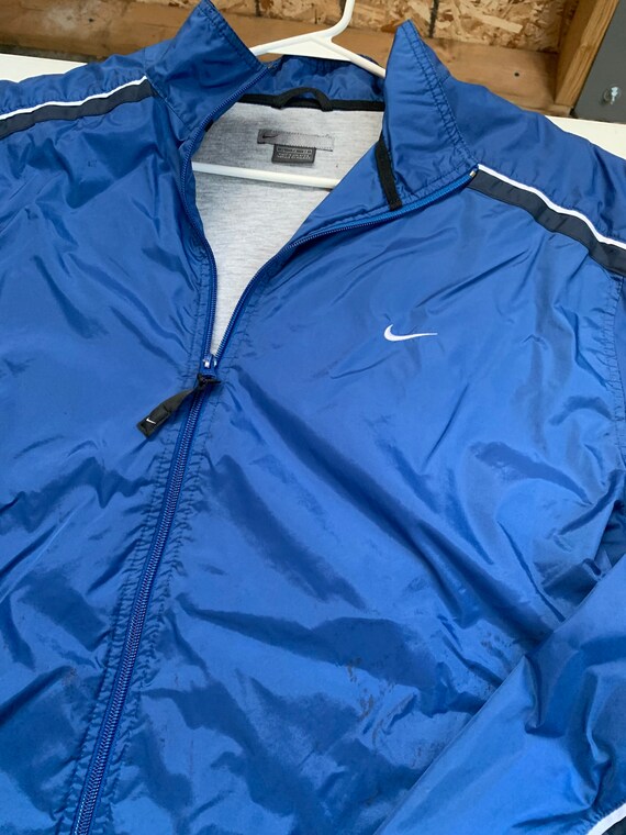 blue black and white nike windbreaker