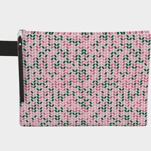 May include: A rectangular pink cosmetic bag with a repeating pattern of green and pink leaf shapes. The bag has a black wrist strap and a black zipper pull.