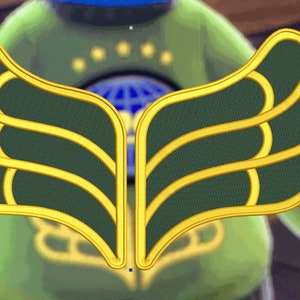 May include: A pair of gold and green wings with a textured fabric design. The wings are sewn onto a green garment.