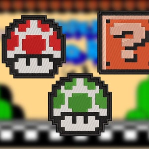 May include: Three pixelated embroidered patches featuring iconic video game characters. A red and white mushroom, a green mushroom, and a brown question block.