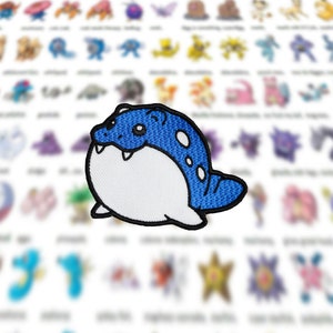 May include: Blue and white embroidered iron-on patch of a cartoon Pokemon character. The character is round and has a large mouth with sharp teeth. The character has blue spots on its back.