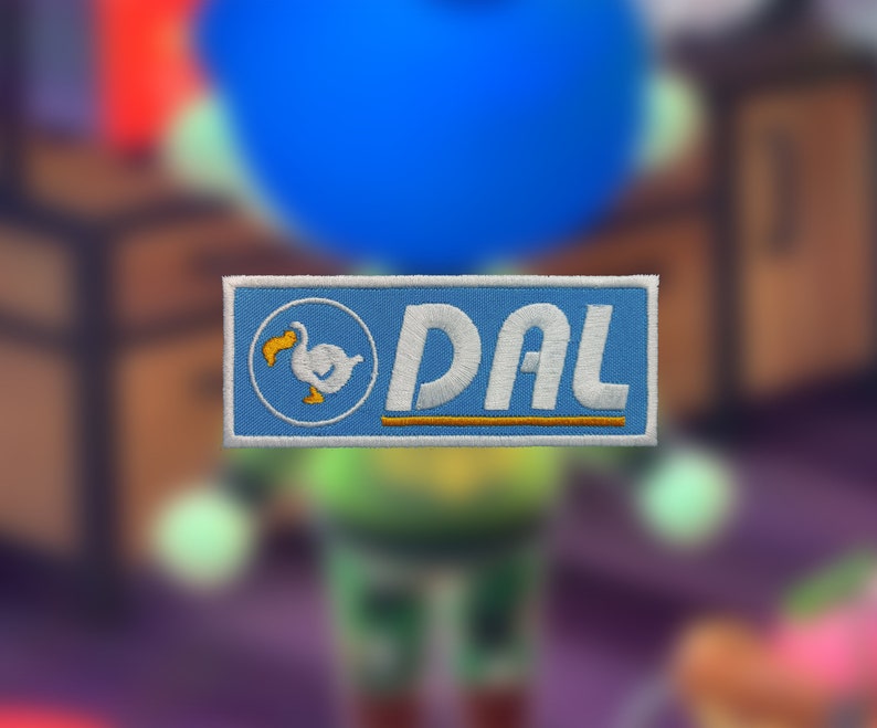 May include: A blue and white embroidered patch with a white dodo bird and the text "DAL" in white letters on a blue background.
