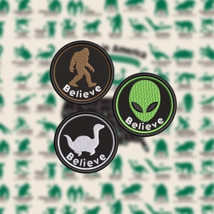 May include: Three embroidered patches with black borders. One shows a brown Bigfoot, another a green alien head, and the last a white dinosaur-like creature. Each patch has the word "Believe" in white.