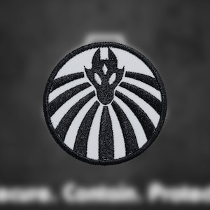 May include: Black and white embroidered patch with a stylized dragon design. The dragon is facing forward with its wings spread out. The patch is circular and has a white background with black lines radiating out from the center.