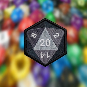May include: A black and gray fabric patch shaped like a twenty-sided die with white numbers 8, 20, 14, and 2.