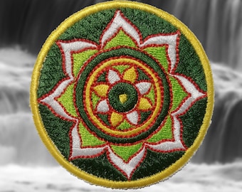 May include: A green, yellow, red, and white embroidered patch with a flower design. The center of the flower has a smaller flower design with a green center.