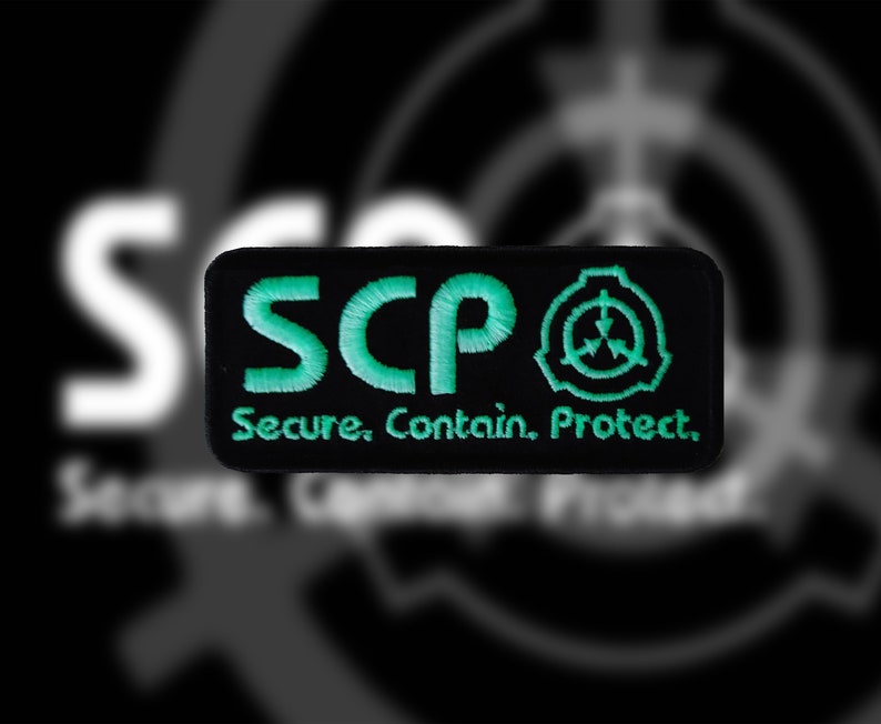 May include: Black and green embroidered patch with the text "SCP" and the SCP logo. The text below the logo reads "Secure. Contain. Protect."