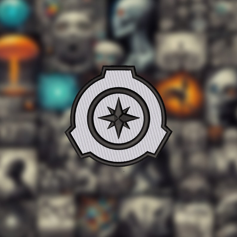 May include: A white and black embroidered patch with a compass design. The compass has a black star in the center and is surrounded by a black circle. The patch is shaped like a gear.