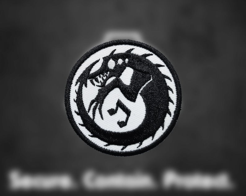 May include: Black and white embroidered patch featuring a stylized creature with sharp teeth and claws. The creature is curled in a circle with its tail in its mouth.