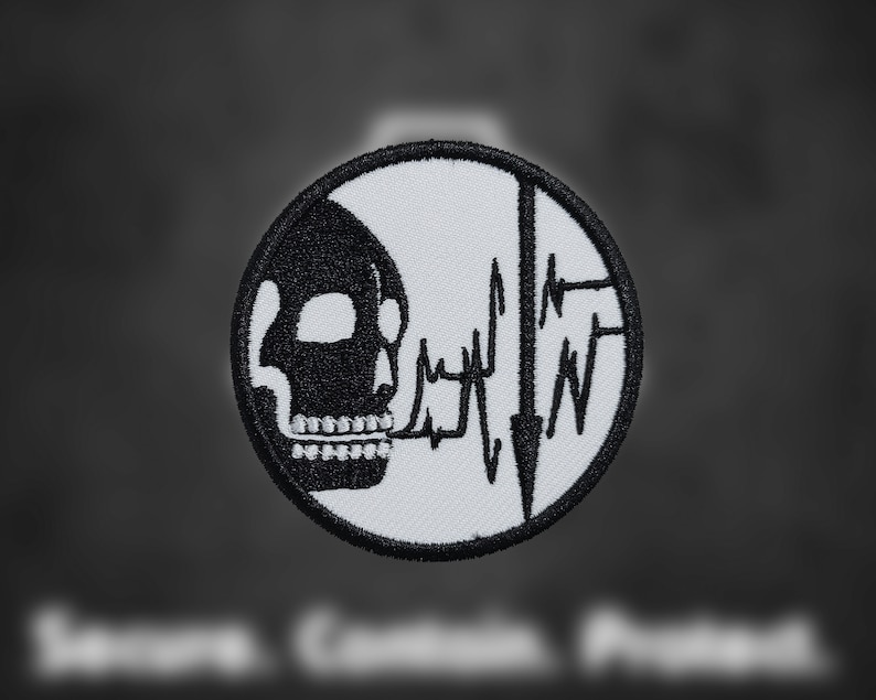 May include: Black and white embroidered patch with a skull and a heartbeat line. The skull is facing left and the heartbeat line is on the right side of the patch.
