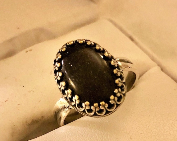 Blue Goldstone adjustable ring encased in a Silver Plated Crown Bezel Setting
