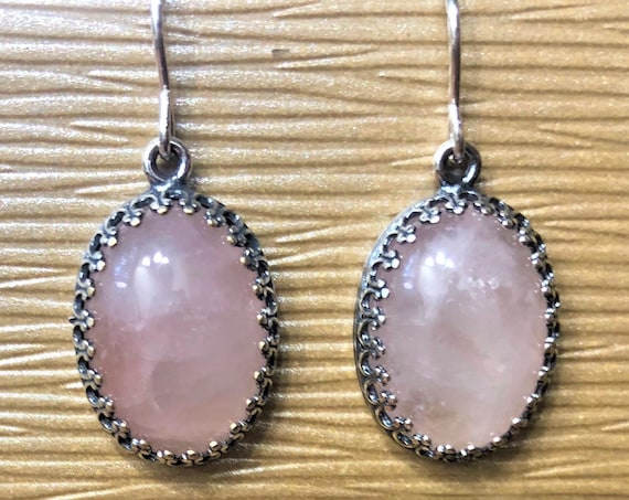 Rose Quartz Earrings boast a silver plated crown bezel setting with sterling silver ear wires.