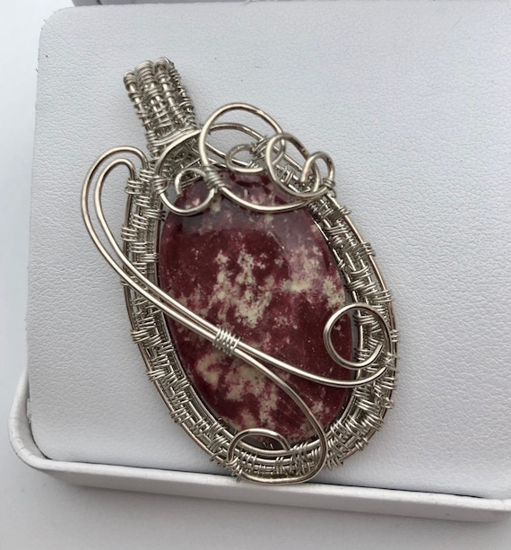 Thulite Pendant wrapped in Sterling Silver Wire.   Thulite properties are Accepting, Sympathetic, Joyful Energy