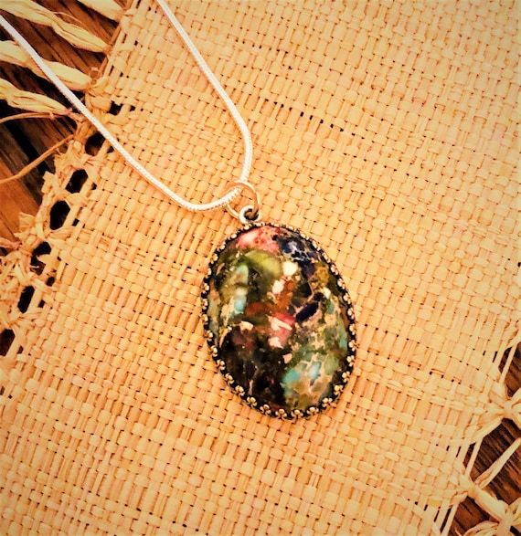 Sea Sediment Jasper Cabochon encased in a Silver Plated Setting.