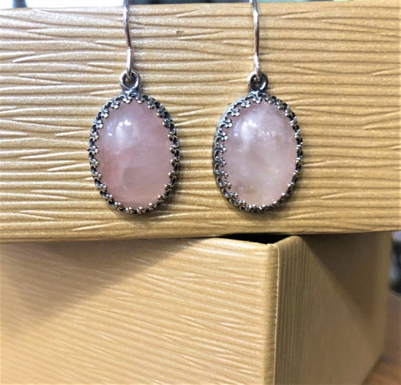 Rose Quartz Earrings boast a silver plated crown bezel setting with sterling silver ear wires.